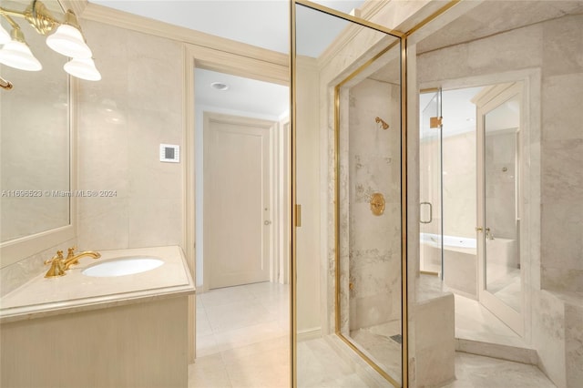 bathroom with vanity, crown molding, tile patterned flooring, tile walls, and an enclosed shower