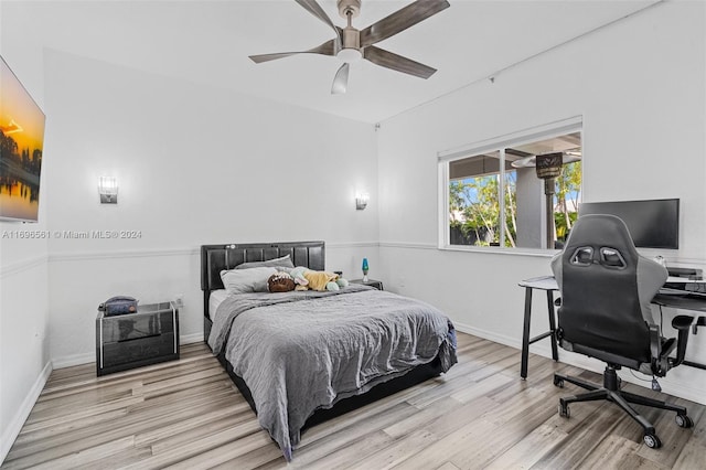 bedroom featuring light wood-type flooring and ceiling fan