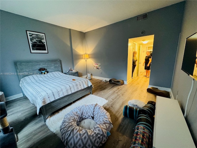 bedroom featuring hardwood / wood-style flooring