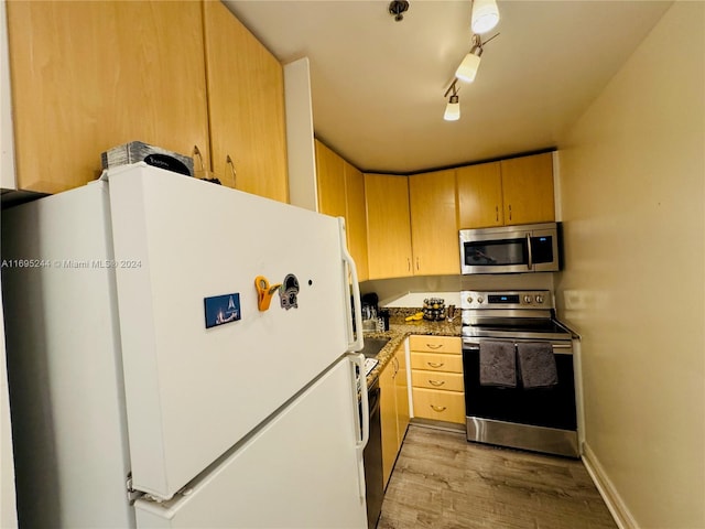 kitchen with light hardwood / wood-style flooring, rail lighting, stainless steel appliances, and light brown cabinets