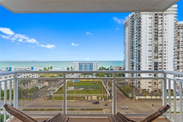 balcony featuring a water view