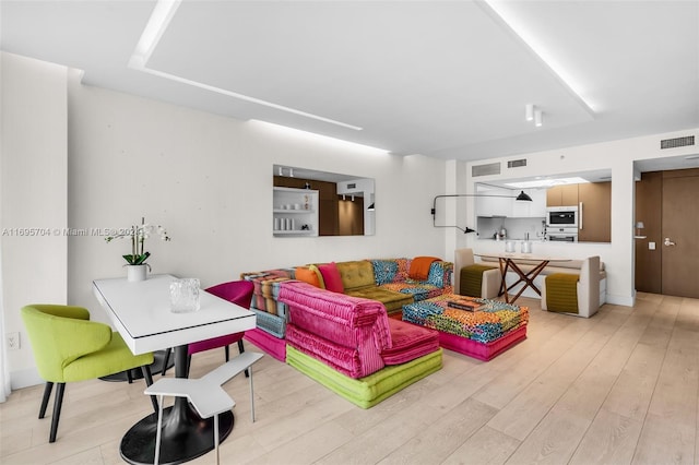 living room featuring light wood-type flooring