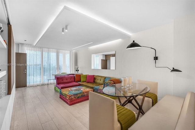 living room featuring light hardwood / wood-style flooring and expansive windows