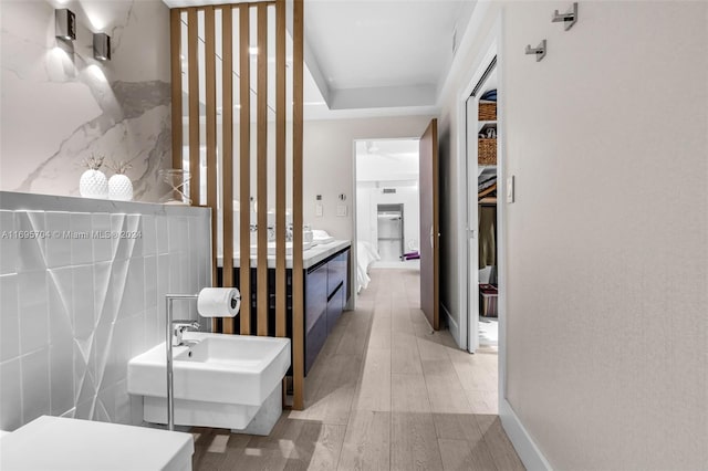 bathroom featuring sink and wood-type flooring