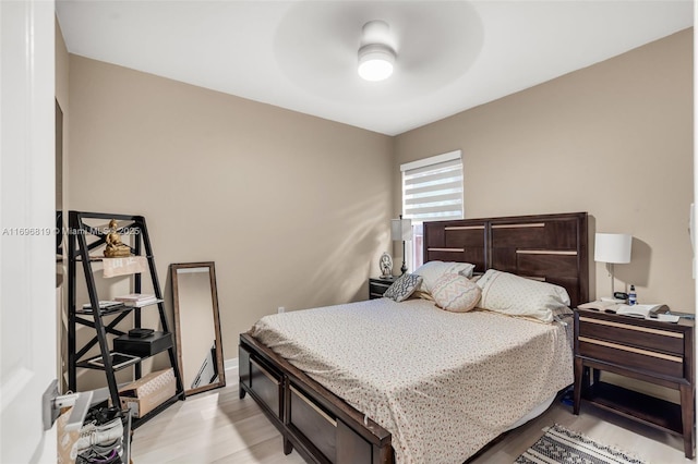 bedroom featuring light hardwood / wood-style flooring and ceiling fan