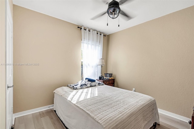 bedroom featuring ceiling fan and light hardwood / wood-style floors