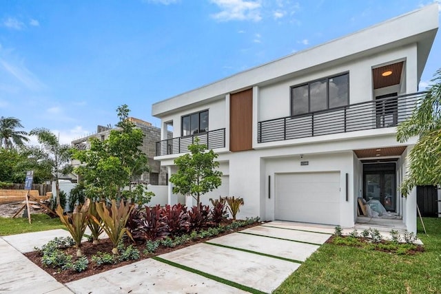 contemporary house with a balcony and a garage