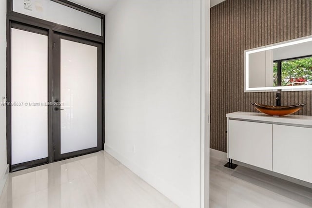 bathroom with tile patterned flooring and vanity