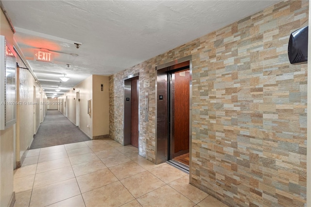 7100 NW 17th St Unit 219, Plantation, FL 33313 - corridor featuring elevator and light tile patterned floors