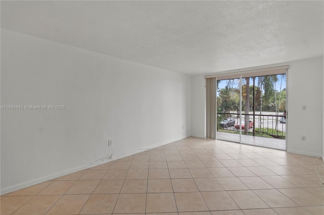 7100 NW 17th St Unit 219, Plantation, FL 33313 - spare room with light tile patterned flooring and baseboards
