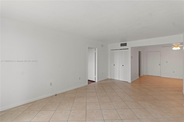 7100 NW 17th St Unit 219, Plantation, FL 33313 - spare room with ceiling fan, light tile patterned floors, and baseboards