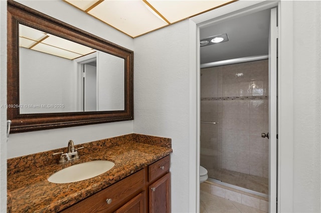 7100 NW 17th St Unit 219, Plantation, FL 33313 - bathroom with vanity, a shower stall, toilet, and tile patterned flooring