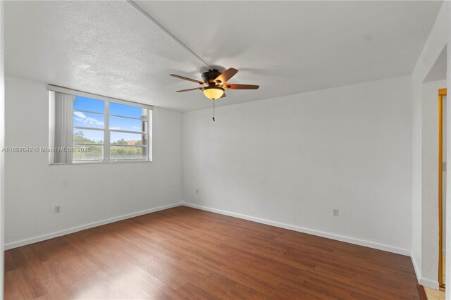 7100 NW 17th St Unit 219, Plantation, FL 33313 - empty room with ceiling fan, wood finished floors, and baseboards