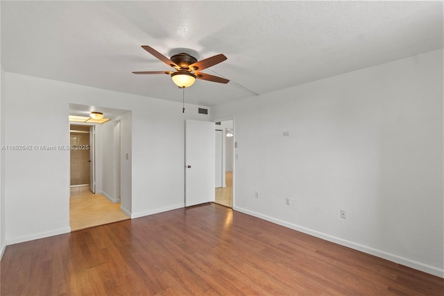 7100 NW 17th St Unit 219, Plantation, FL 33313 - empty room with a ceiling fan, wood finished floors, and baseboards