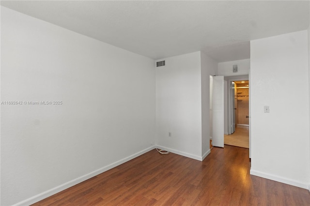 7100 NW 17th St Unit 219, Plantation, FL 33313 - empty room featuring baseboards and wood finished floors