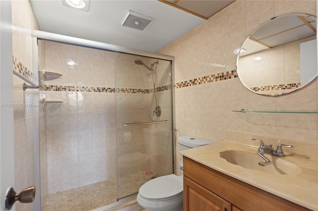 7100 NW 17th St Unit 219, Plantation, FL 33313 - bathroom with tile walls, toilet, a shower stall, and vanity