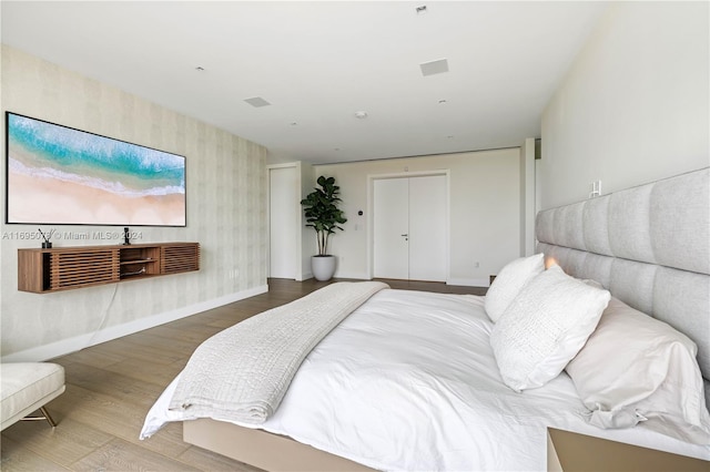 bedroom with wood-type flooring