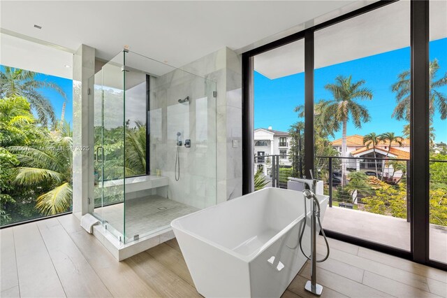 bathroom featuring tile patterned floors, toilet, vanity, and walk in shower