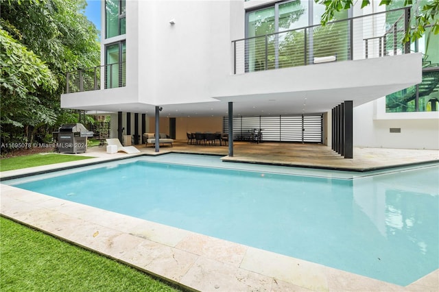 view of pool featuring a patio area