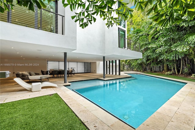 view of pool featuring a patio area and an outdoor living space