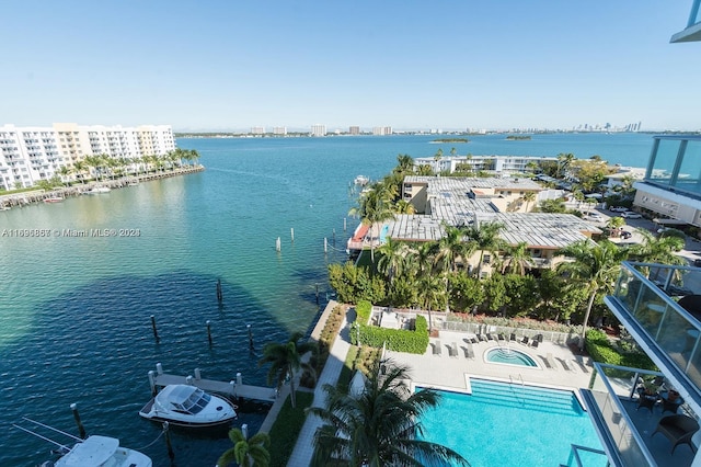 birds eye view of property featuring a water view