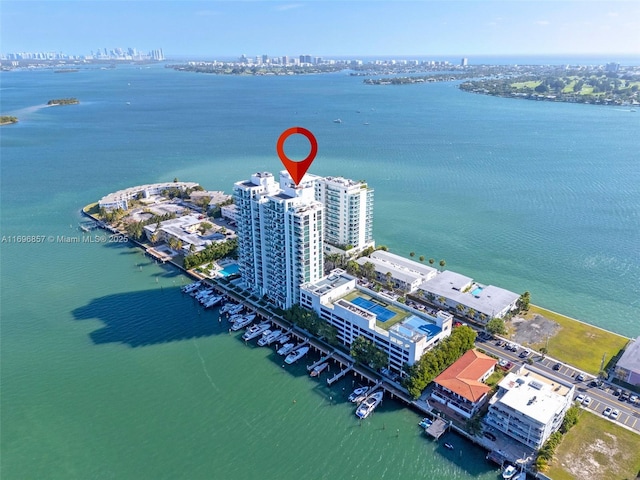 birds eye view of property featuring a water view and a view of city