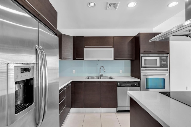 kitchen with visible vents, appliances with stainless steel finishes, light countertops, and a sink