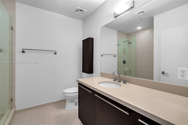 bathroom with visible vents, vanity, toilet, and a shower stall