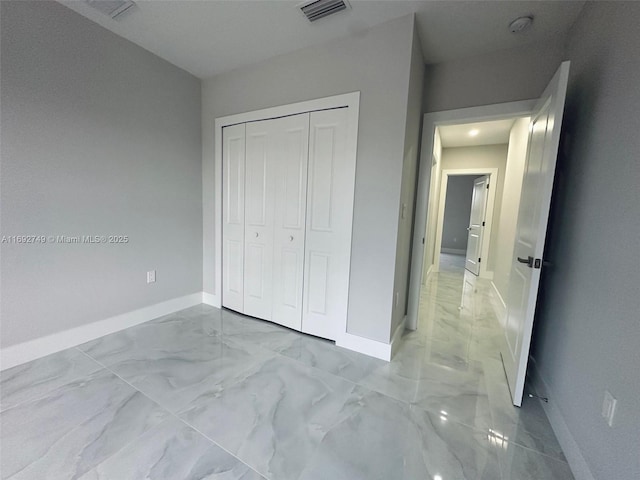 unfurnished bedroom with a closet