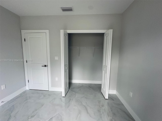 unfurnished bedroom with a closet