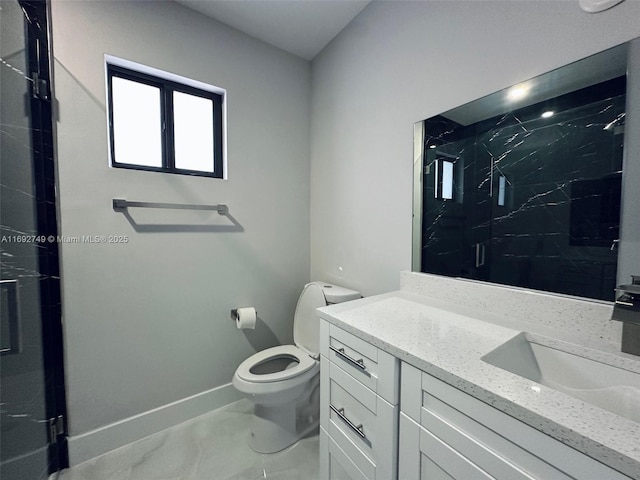 bathroom with vanity, toilet, and walk in shower