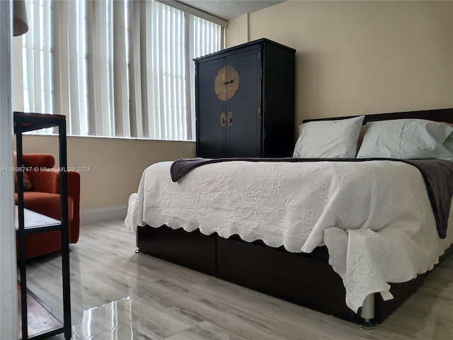 bedroom with wood-type flooring