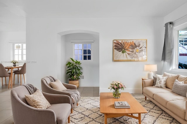 living room with a healthy amount of sunlight and light tile patterned floors