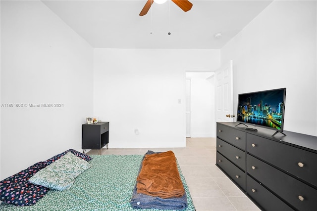 bedroom with ceiling fan and light tile patterned floors