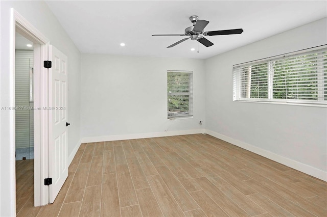 unfurnished room featuring light wood-type flooring and ceiling fan