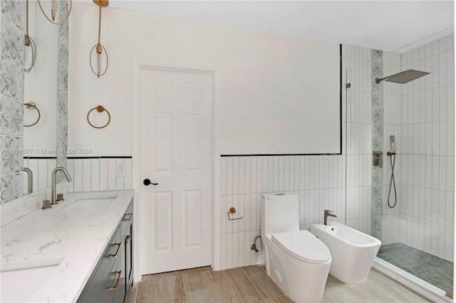 bathroom with hardwood / wood-style floors, a bidet, tile walls, and tiled shower