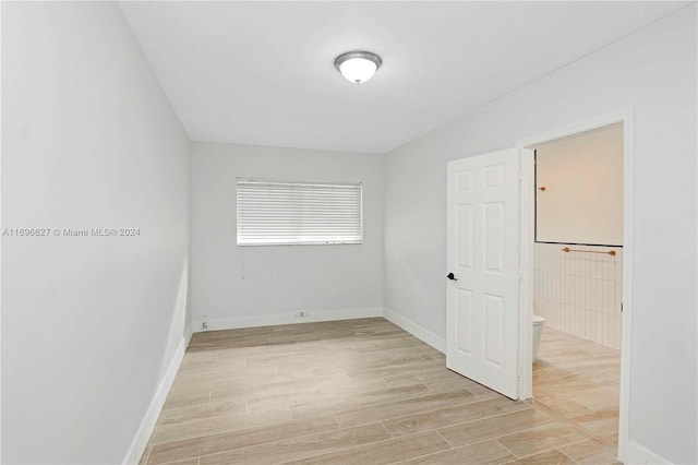 unfurnished room featuring light hardwood / wood-style flooring