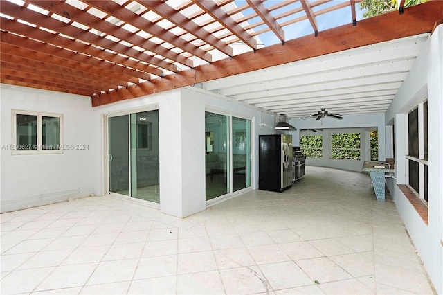 view of patio / terrace with a pergola and ceiling fan