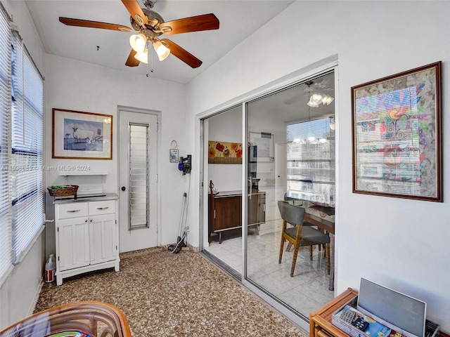 interior space featuring ceiling fan and a healthy amount of sunlight