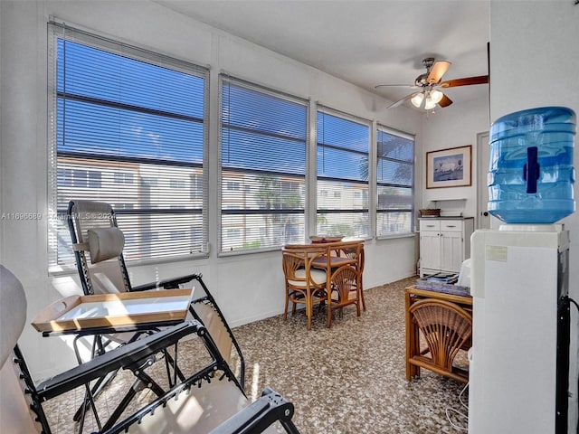 sunroom with ceiling fan