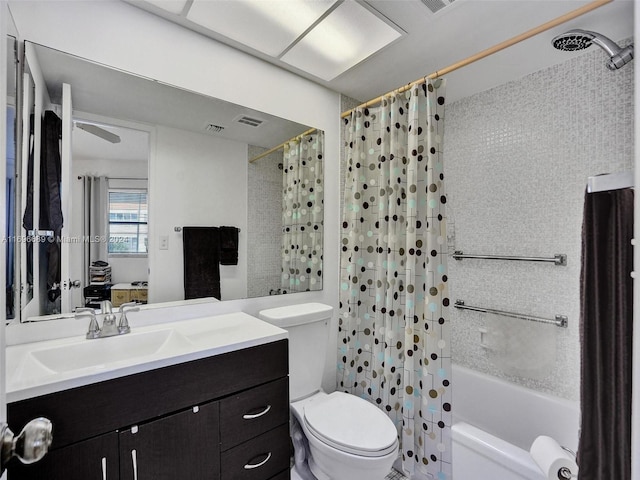 full bathroom featuring vanity, shower / bath combo, and toilet