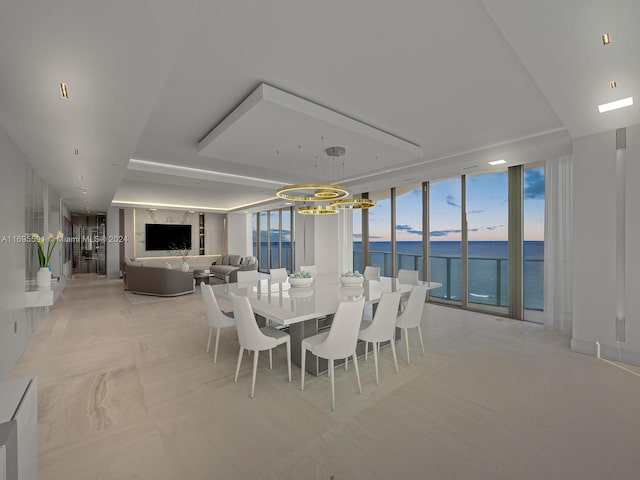 dining space featuring a wall of windows