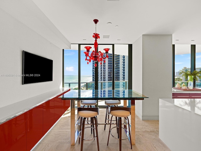 dining space with floor to ceiling windows, a chandelier, and a healthy amount of sunlight