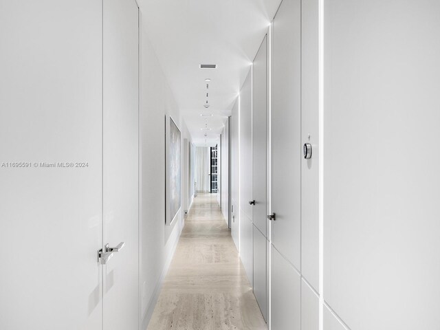 hallway featuring light wood-type flooring