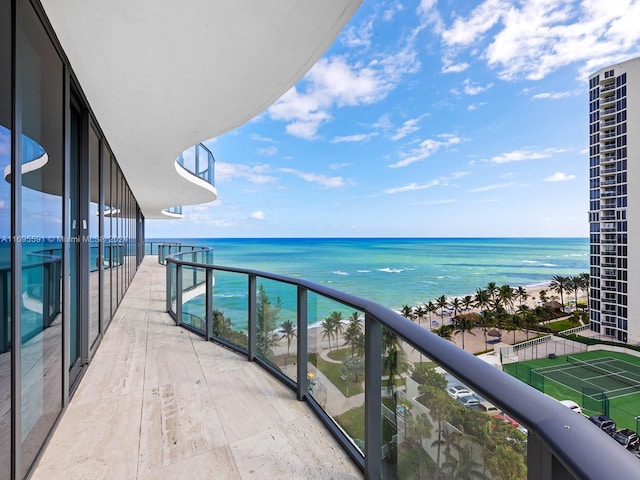 balcony featuring a water view