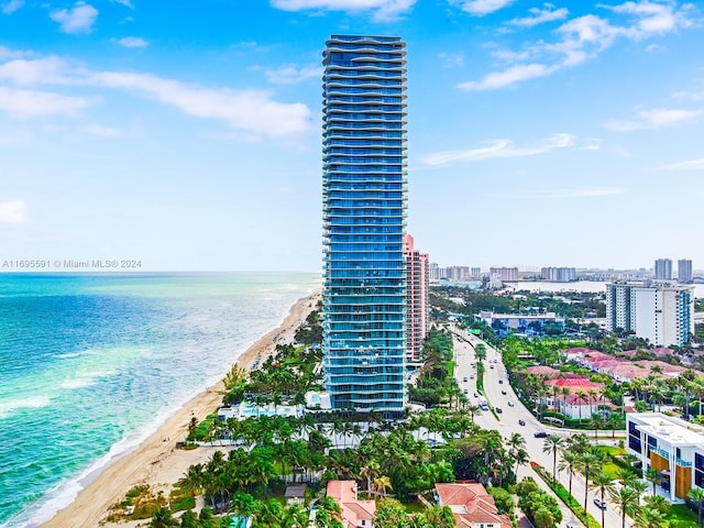 aerial view with a view of the beach and a water view