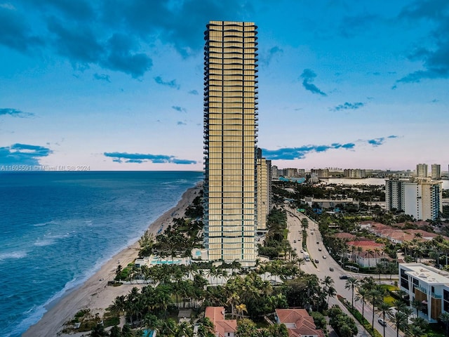 aerial view featuring a water view and a beach view