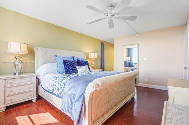 6921 Environ Blvd Unit 8N, Lauderhill, FL 33319 - bedroom with dark wood finished floors, baseboards, and ceiling fan