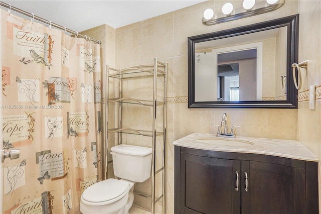 bathroom featuring vanity, backsplash, toilet, tile walls, and curtained shower