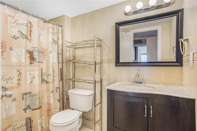 6921 Environ Blvd Unit 8N, Lauderhill, FL 33319 - full bath with tile walls, vanity, toilet, and a shower with shower curtain